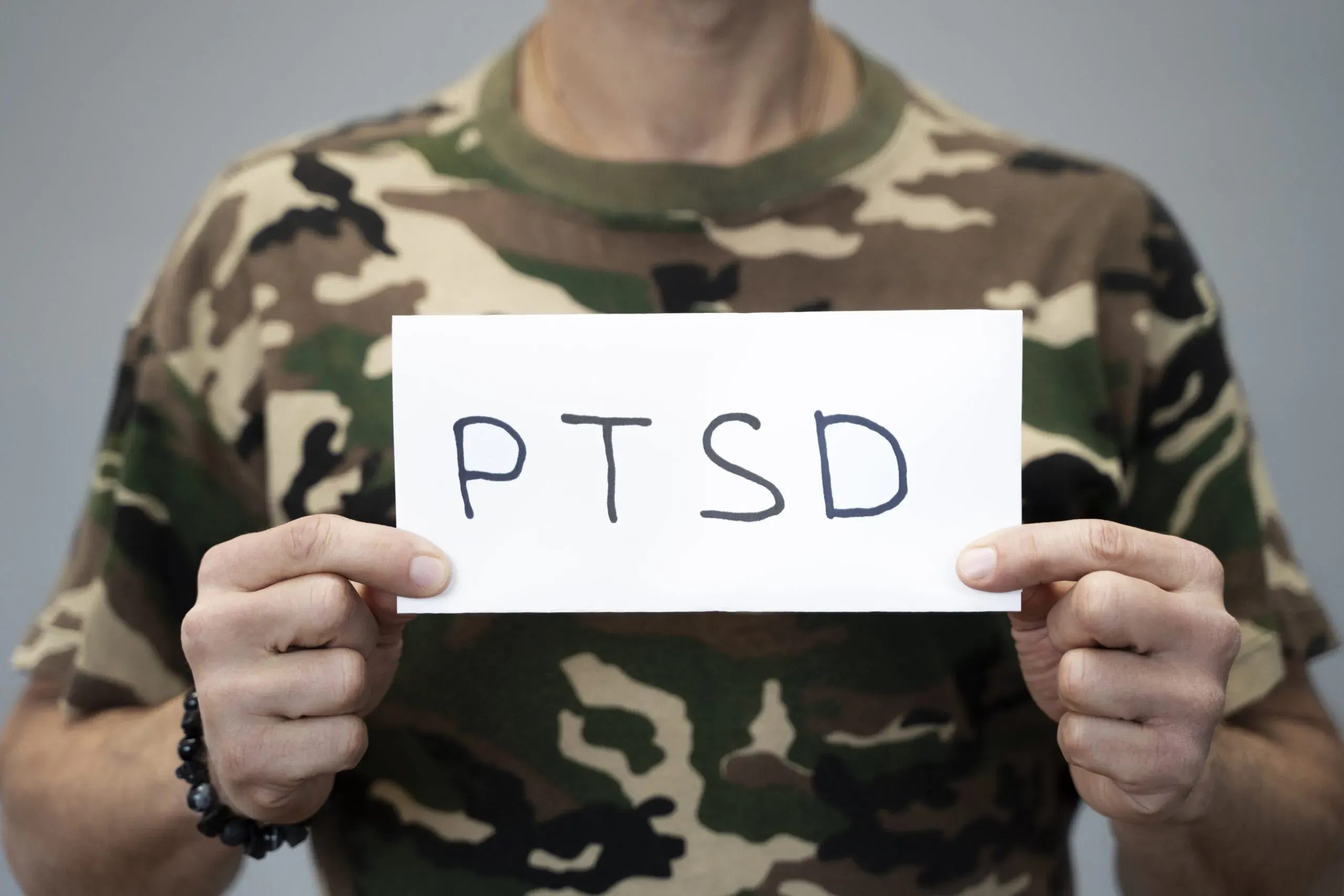 Individual reflecting on suicidal thoughts, highlighting the importance of recognizing warning signs